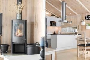 a kitchen and a living room with a fireplace at LN1954-Hirtshals-Harestien-27 in Hirtshals +11 photos