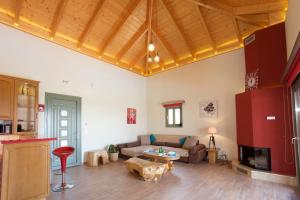 a living room with a couch and a table at Trapezaki Queen Villa in Trapezaki