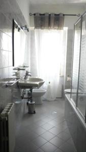 a bathroom with a sink and a toilet at Sant'Agostino Apartment in Catanzaro