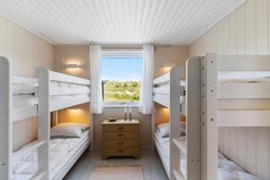 a room with two bunk beds and a window at LN1938-Hirtshals-Kranken-9 in Hirtshals