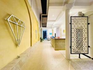 a hallway of a building with a wall with a window at Secret Gem in Arugam Bay +59 photos