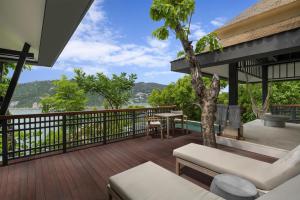 a deck with a view of the water at Banyan Tree Cabo Marques in Acapulco