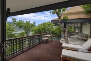 a balcony with a view of a house at Banyan Tree Cabo Marques in Acapulco