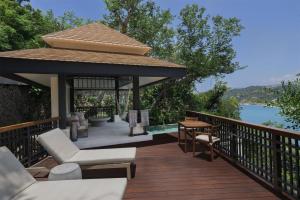 a gazebo with a table and chairs on a deck at Banyan Tree Cabo Marques in Acapulco +134 photos