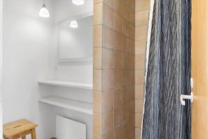 a bathroom with a shower and a shower curtain at LN1963-Hirtshals-Klynen-19 in Hirtshals +28 photos