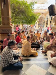 a group of people sitting on the floor in a building at SR Palace - Best Hotel in Vrindavan Near Prem Mandir and Iskcon Temple with Private Parking in Vrindāvan