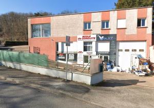 a building that is under construction next to a street at Doux Pavillon - Sauna - Jacuzzi in Tassin-la-Demi-Lune