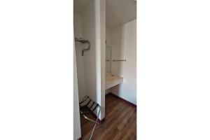 a small room with a closet and a shelf at Albuquerque Inn Near Airport I 40 in Albuquerque