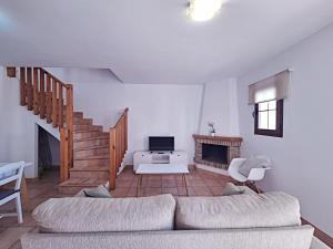 a living room with a couch and a fireplace at Harbour Lights IV in Villaricos
