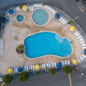 an overhead view of a swimming pool with chairs at Sun Outdoors Cape May in Cape May