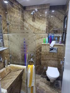 a bathroom with a shower and a toilet in it at Nashwa m mohamed in Ain Sokhna +13 photos