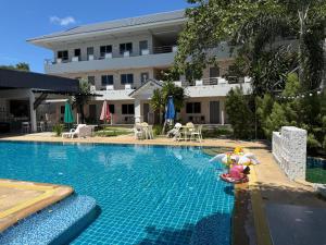 a swimming pool with a toy in the water at Amaya Bloom Resort & Spa in Pattaya