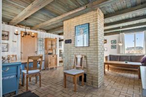 a kitchen and living room with a brick wall at LN76158-Hjorring-Bredningen-18 in Hjørring