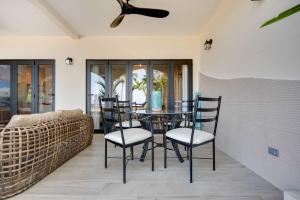 a dining room with a table and chairs at Playa Potrero Beachfront Ocean Views, Pool & BBQ in Santa Cruz +27 photos