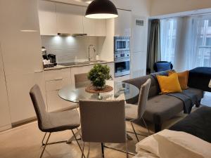 a living room with a couch and a table at Stylish Downtown Toronto Residential Hotel in Toronto