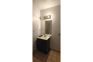a bathroom with a sink and a mirror at Albuquerque Inn Near Airport I 40 in Albuquerque +23 photos