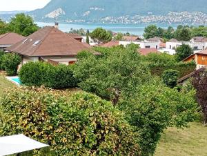 a view of a city with houses and trees at VUE LAC LODGES in Sévrier +12 photos