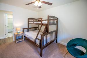a bedroom with two bunk beds and a ceiling fan at Sun Outdoors Cape May in Cape May +62 photos