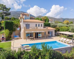 an image of a villa with a swimming pool at Villa Joya by Villa Select in Skala