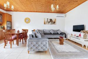 a living room with a couch and a table at Villa Kevin in Berat