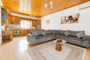 a living room with a couch and a table at Villa Kevin in Berat