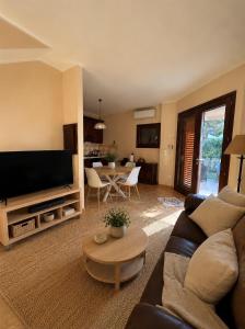 a living room with a couch and a table at Villa Fabi in Brindisi