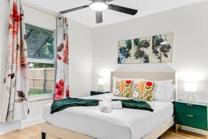 a bedroom with a bed and a ceiling fan at Splash & Relax Games WiFi BBQ Fire Pit Boat Lake in Royal Palm Beach