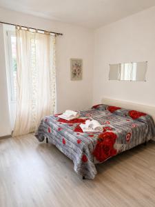 a bedroom with a bed with a comforter on it at Lescen White Residence - Lake View in Lezzeno +31 photos