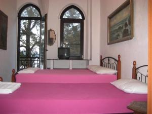 Un pat sau paturi într-o cameră la Apartments Colic