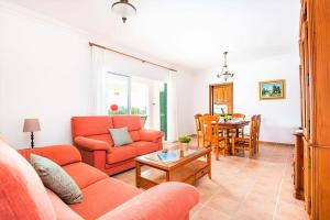 a living room with a couch and a table at Villa Son Domingo by Villa Select in Alaior