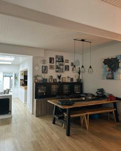 a living room with a wooden table in a room at Jimy Hendrickx in Boom