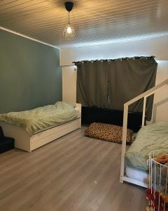 a bedroom with two bunk beds and a window at Jimy Hendrickx in Boom