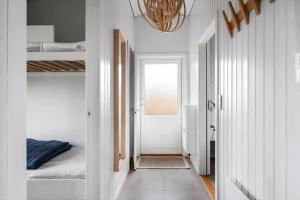 a hallway with a room with a bed and a door at LN2048-Hjorring-Havmanden-6 in Kærsgård Strand