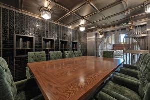 a conference room with a wooden table and chairs at The Miners 1928 Hotel in Pottsville