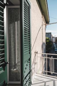 an open door on a balcony with a window at 3Season Ortona B&B in Ortona