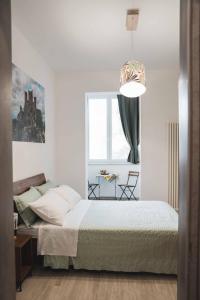 a bedroom with a bed and a window at 3Season Ortona B&B in Ortona
