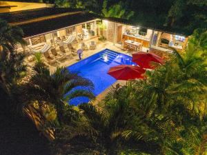 an overhead view of a swimming pool with umbrellas at Majestic Sands in San Carlos