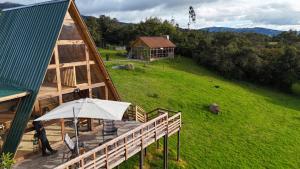 an overhead view of a wooden deck with an umbrella at Monte Waïa in Guasca