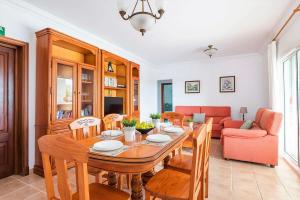 a dining room with a table and a couch at Villa Son Domingo by Villa Select in Alaior