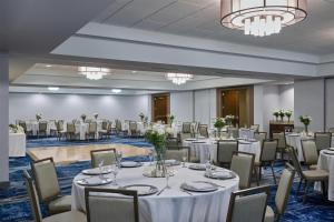 a banquet hall with white tables and chairs at DoubleTree by Hilton Irvine Spectrum in Irvine +38 photos