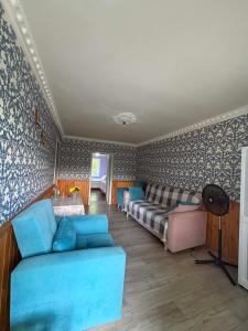 a living room with a couch and a bed at Elasia in Martvili