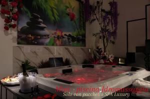 a large bath tub filled with lots of red liquid at Relax in Puglia in Corato