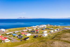 an aerial view of a campgrounds next to the ocean at FarNorth Hostel in Bakkafjörður