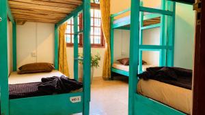 a room with two bunk beds in a room at Ceylon Glory Hostel in Negombo