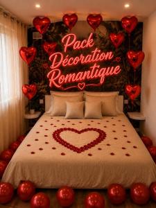 a bed with a sign that reads park declaration romance at La Cachette - Studio Nature - Terrasse Privée in Corbeil-Essonnes