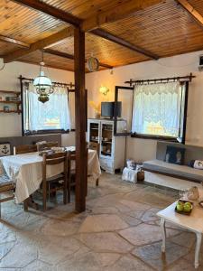 a living room with a table and a dining room at Fisherman's Cove Epanomi in Epanomi +53 photos