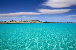 a large body of water with a bridge in the background at Little EsCape in Matlacha