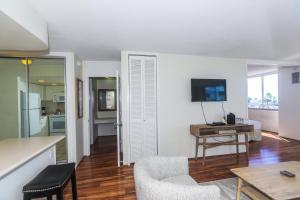 a living room with a couch and a table at Ilikai Marina 382 in Honolulu