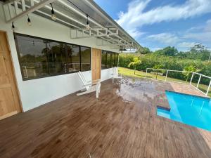 an empty house with a deck and a swimming pool at Casa Isabella in Ángeles