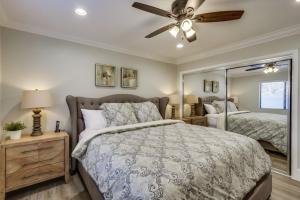 a bedroom with a bed and a ceiling fan at 5 Bedroom plus loft room, 3 Bath home in Fullerton